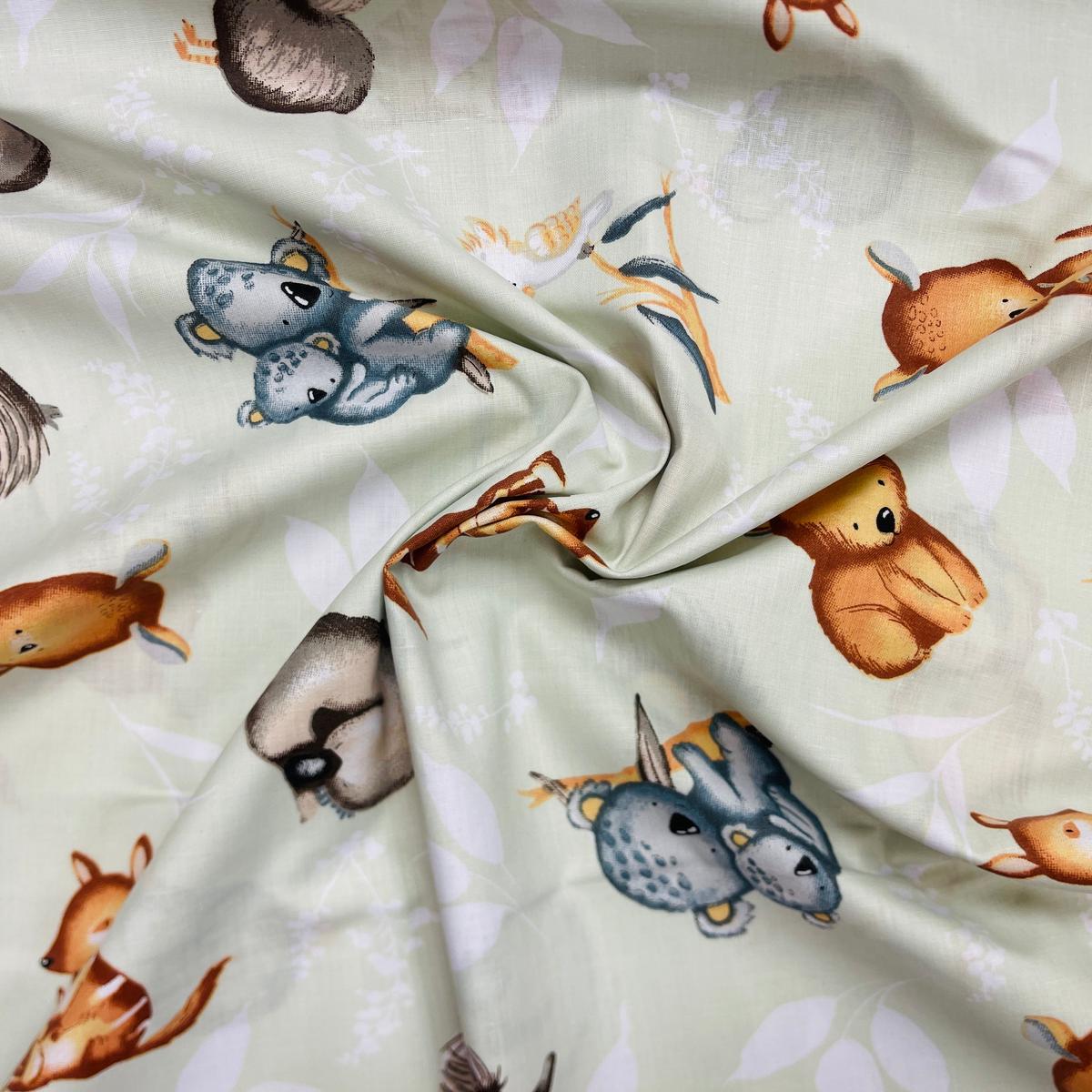 100% Cotton fabric - Australian animals on a soft green background 125 g/m